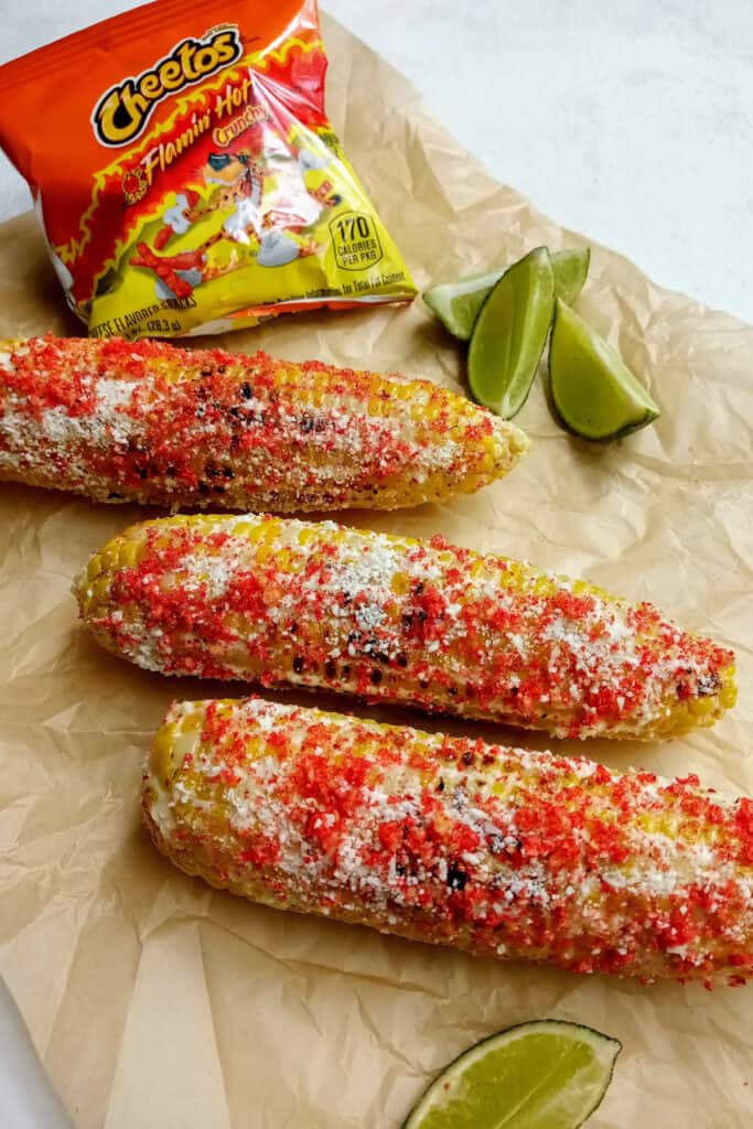 Mexican corn with crushed hot Cheetos and fresh limes.