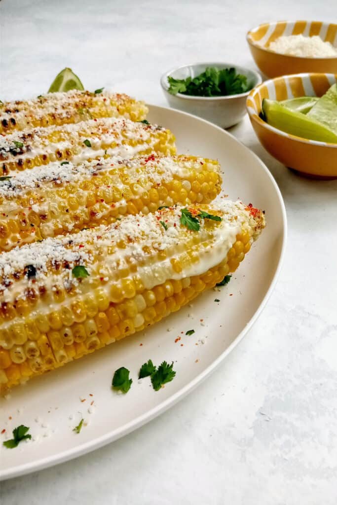 Mexican corn on the cob with fresh garden chopped cilantro and lime juice.