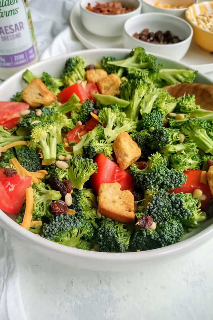 Broccoli salad topped with croutons and raisins.