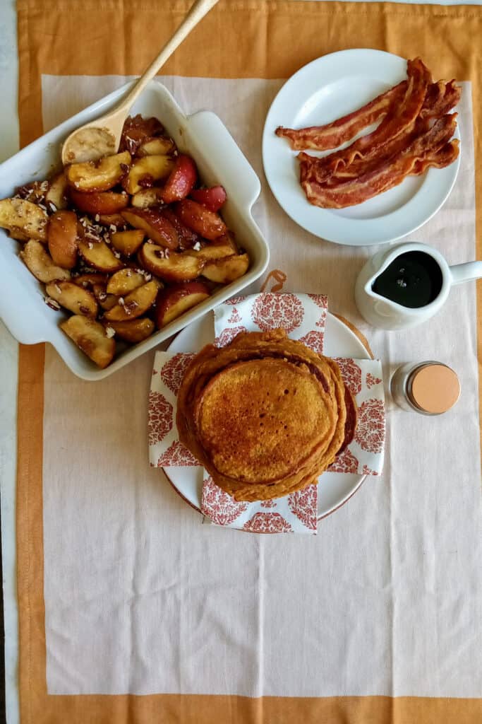 Pumpkin pancakes with brown sugar apples and crispy bacon is the perfect breakfast spread!