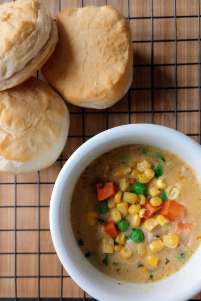 Copycat potbelly chicken potpie soup is a soup with fresh veggies, slow-roasted chicken, and topped with crumbled piecrust or buttermilk biscuits.