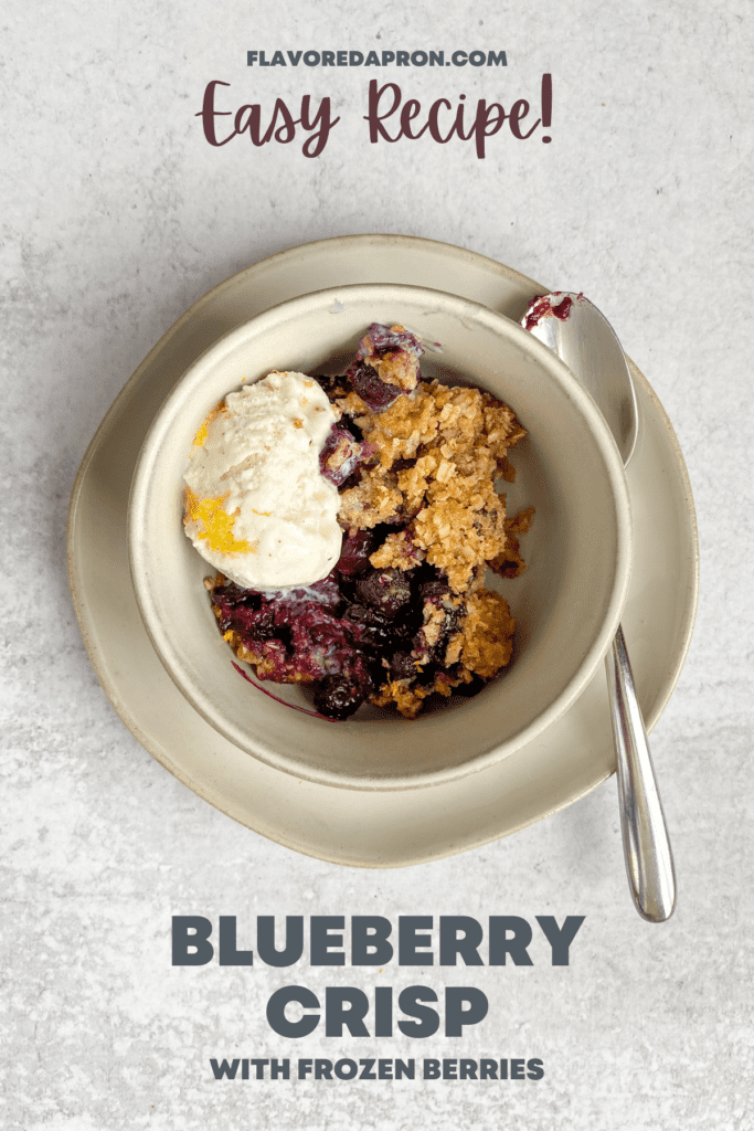 Bowl of blueberry crisp and ice cream.