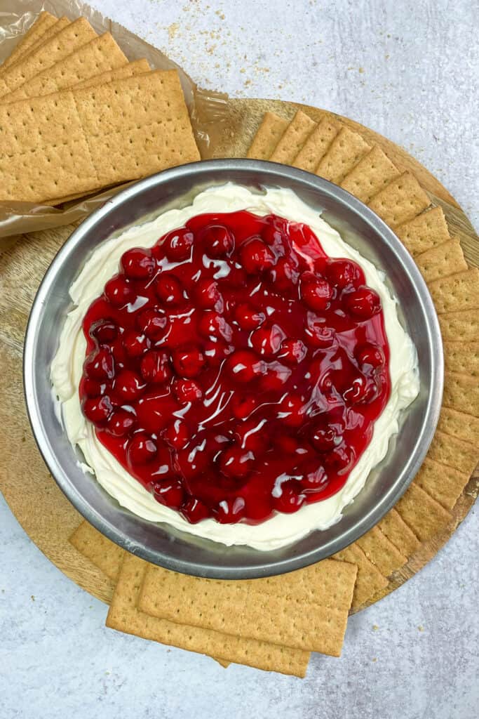 Cherry cheesecake dip served with graham crackers for dipping.
