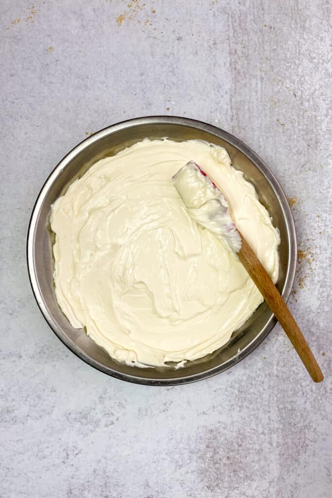 Cheesecake dip spread in a shallow dish for serving.