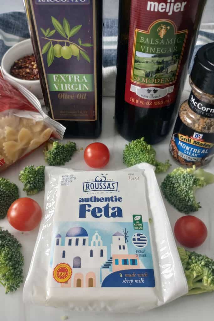 Broccoli, grape tomatoes, and feta cheese block. 