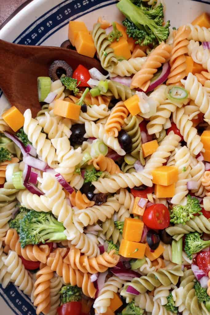 Cheddar broccoli pasta salad with fresh vegetables. Tossed with Italian dressing.