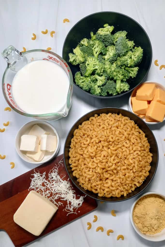 White American cheese, elbow noodles, ground mustard, salt, pepper, velveeta cubed, and fresh chopped broccoli. don't forget the milk and chicken broth.