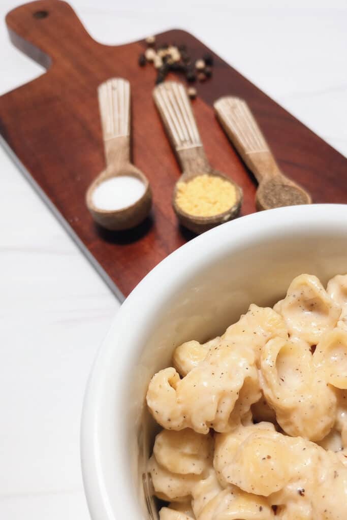 Ground mustard, salt, and pepper on a chopping board.