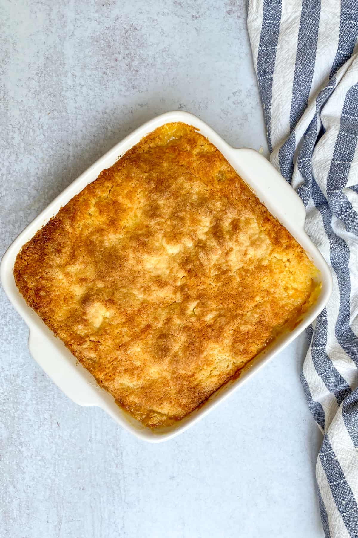 Easy Peach Cobbler with Canned Peaches and Cake Mix Flavored Apron