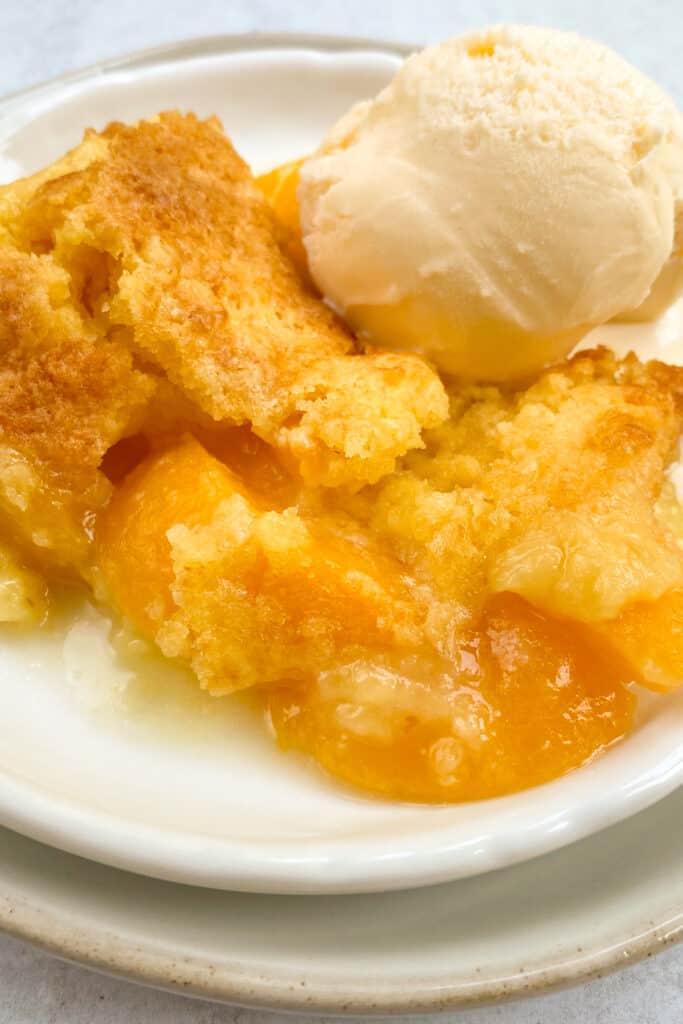 Easy Peach Cobbler with Canned Peaches and Cake Mix Flavored Apron