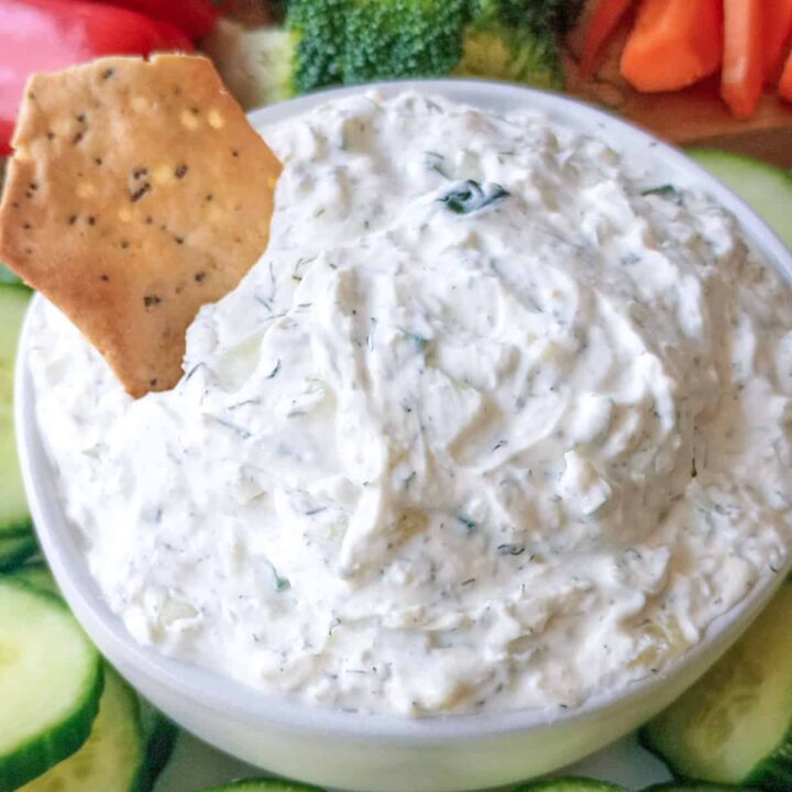 Cucumber dill dip with gluten free everything bagel chip.