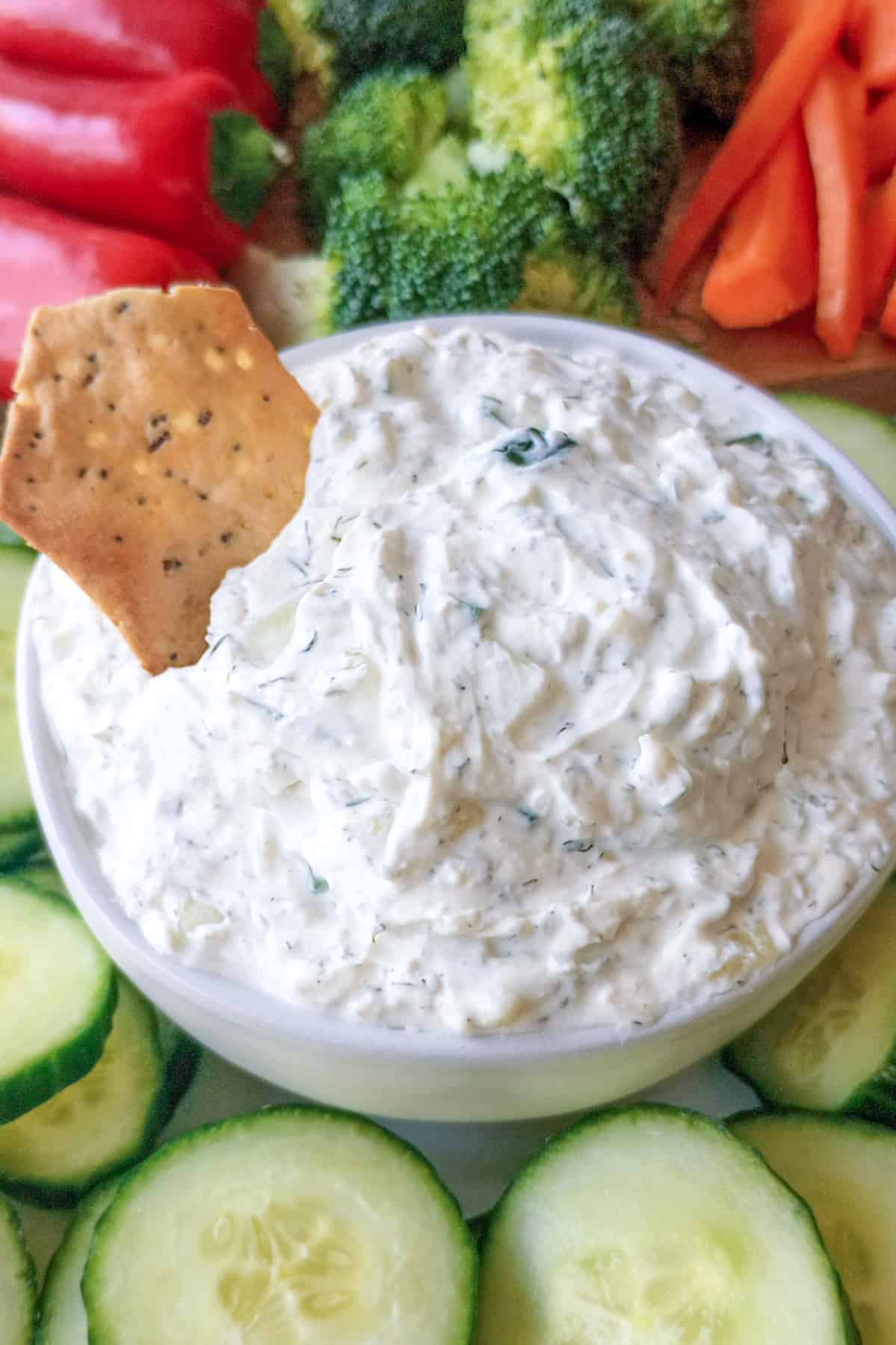 Cucumber dill dip with gluten free everything bagel chip.