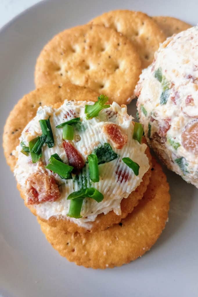 Buttery Ritz cracker topped with bacon jalapeno cheese and green onions.