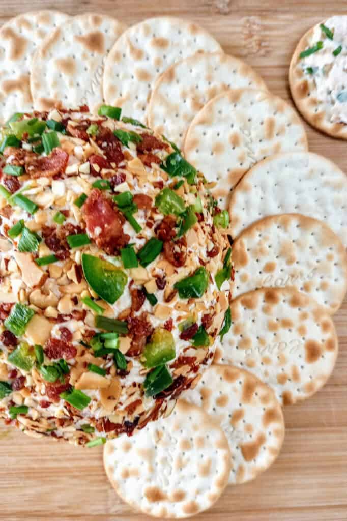 Jalapeno popper cheese balls are delicious topped with roasted almonds.