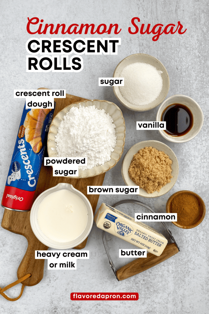 A can of Pillsbury Crescents dough, stick of butter, and bowls of all the ingredients needed to make this dessert recipe, including sugar, brown sugar, powdered sugar, ground cinnamon, vanilla extract and cream.