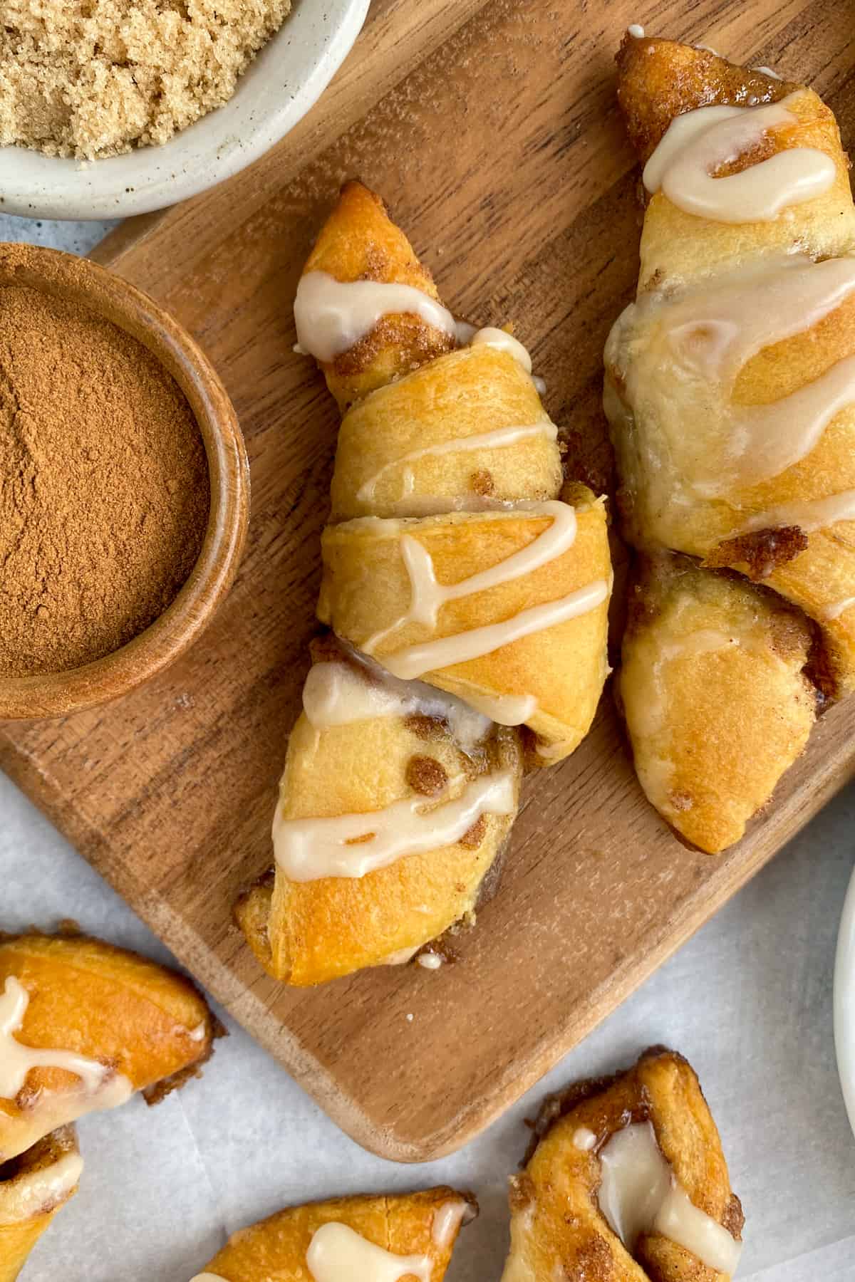 Cinnamon Sugar Crescent Rolls for dessert drizzled with sweet vanilla glaze and buttery cinnamon oozing out of the roll.