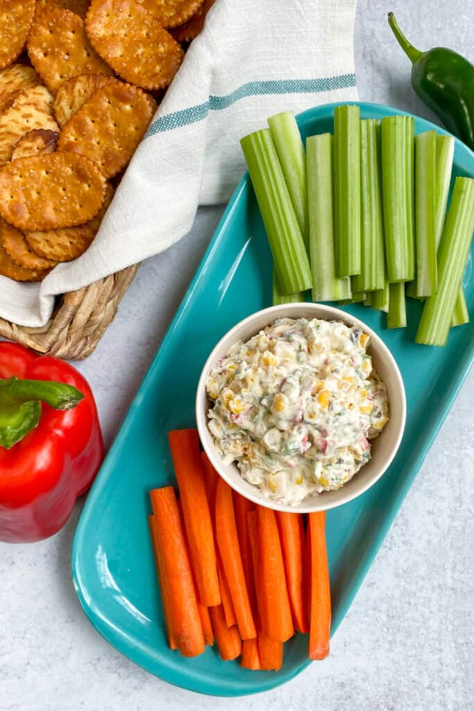 Skinny Poolside Dip on a platter with carrot and celery sticks.