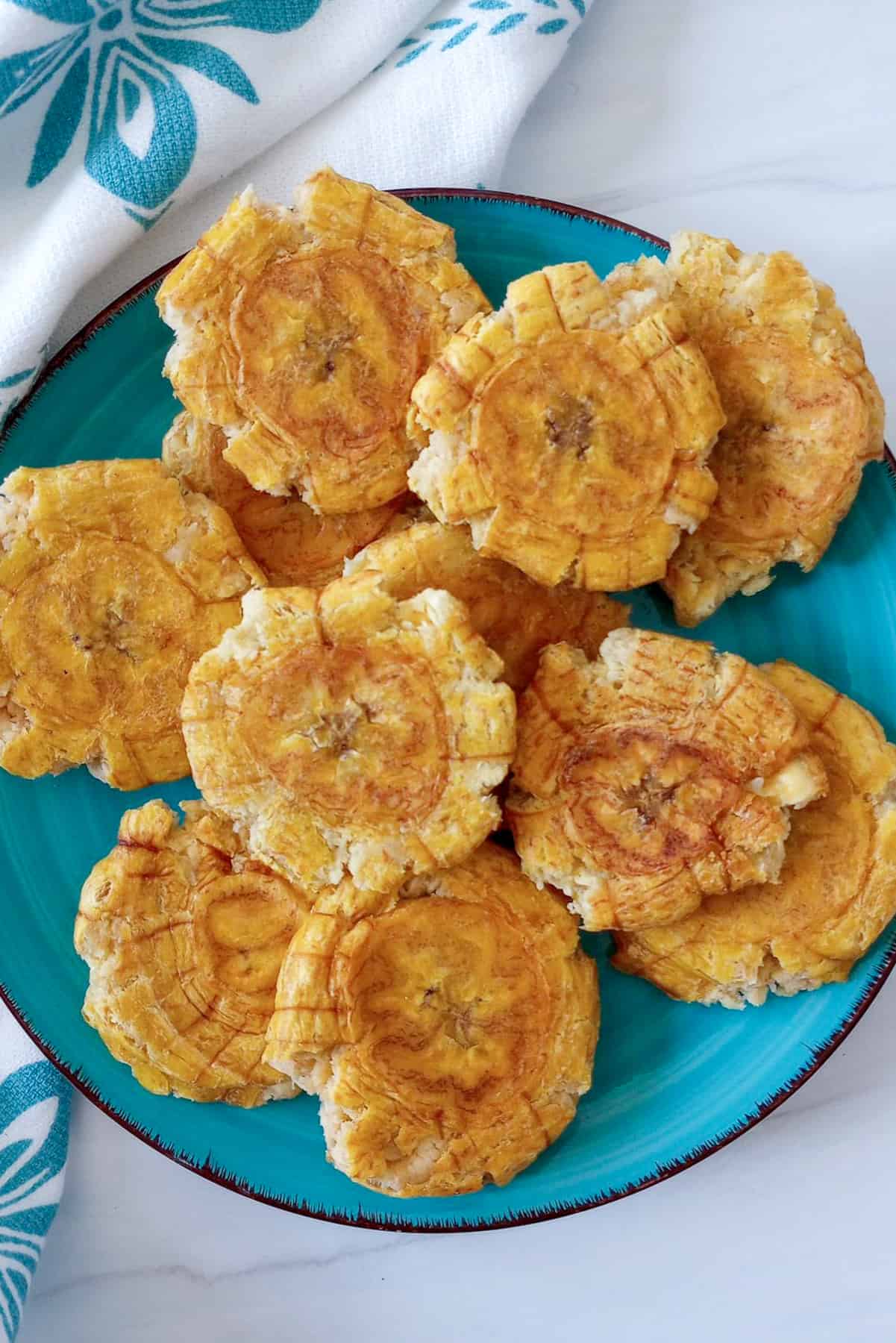 How to Make Fried Green Plantains (Tostones) - Flavored Apron