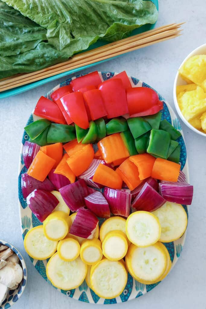 A rainbow assortment of fresh veggies. Chopped and ready to go! 