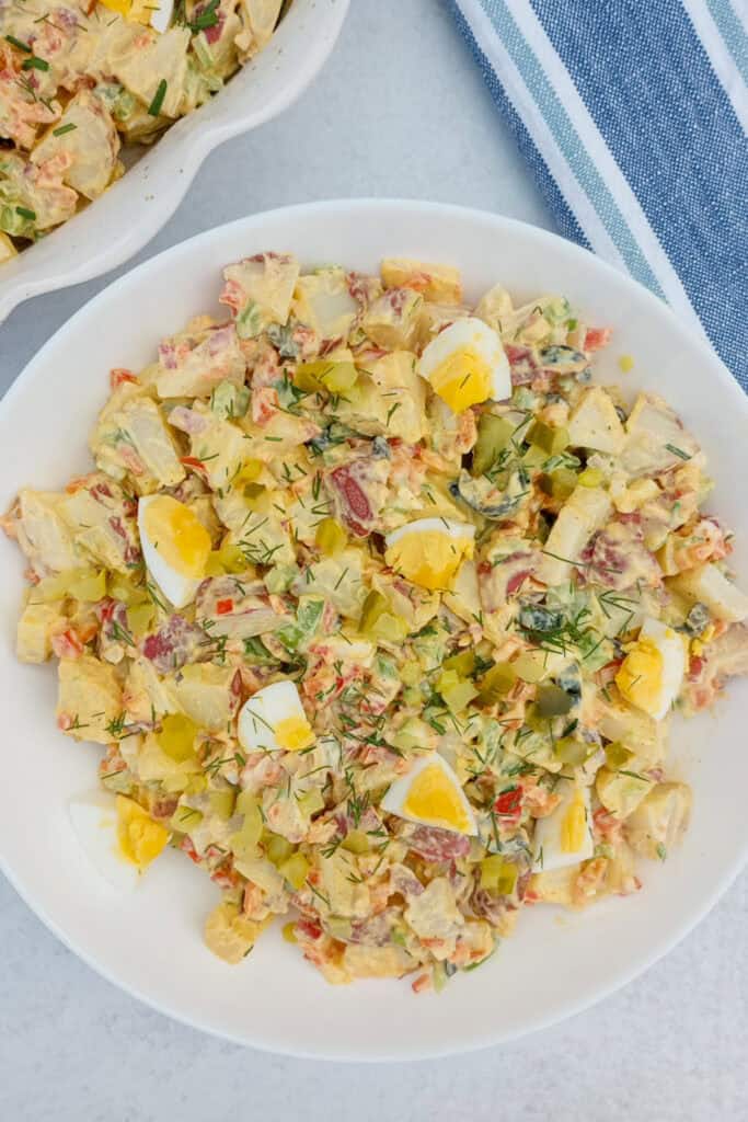 Red potato salad with hard boiled eggs and a mayo-free dressing.