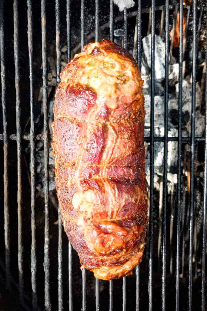 Steak and cheese with mango avocado stuffing on the grill. 