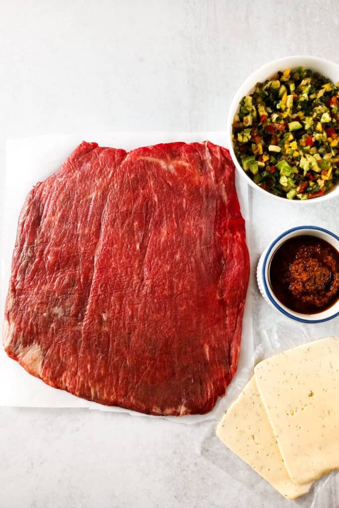 Flank steak, red pesto sauce, Havarti dill cheese, and mango-avocado salsa are all that's needed to make an elegant main dish. Serve alongside roasted broccoli or asparagus.