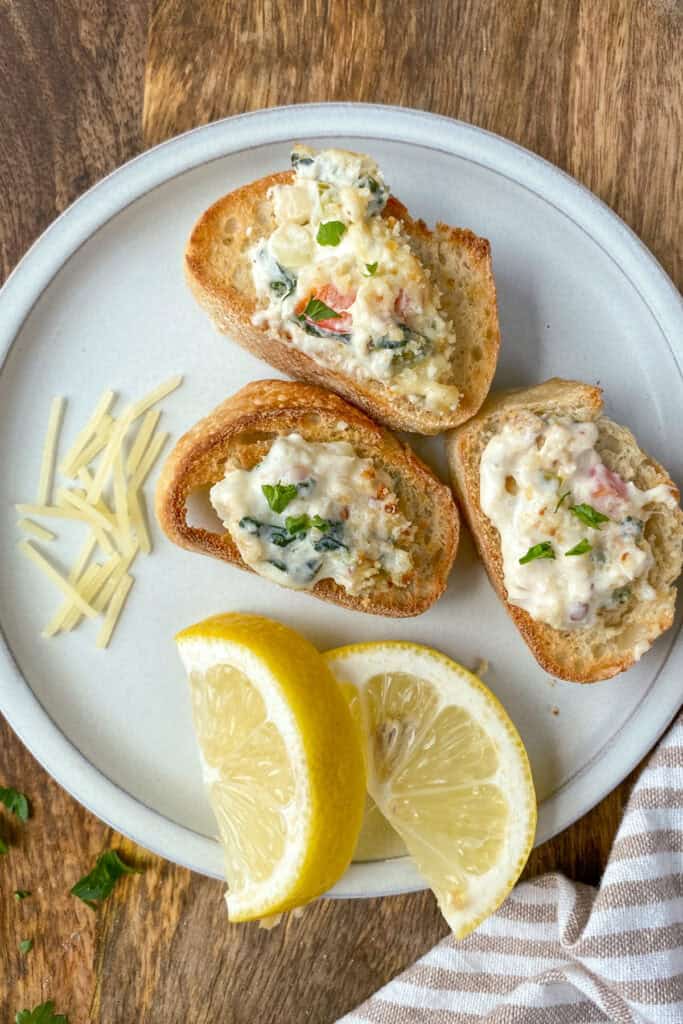 Crab and shrimp dip on warmed baguette bread. 