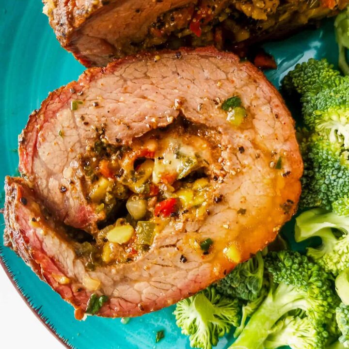 Grilled flank steak roll up stuffed with cheese and salsa.