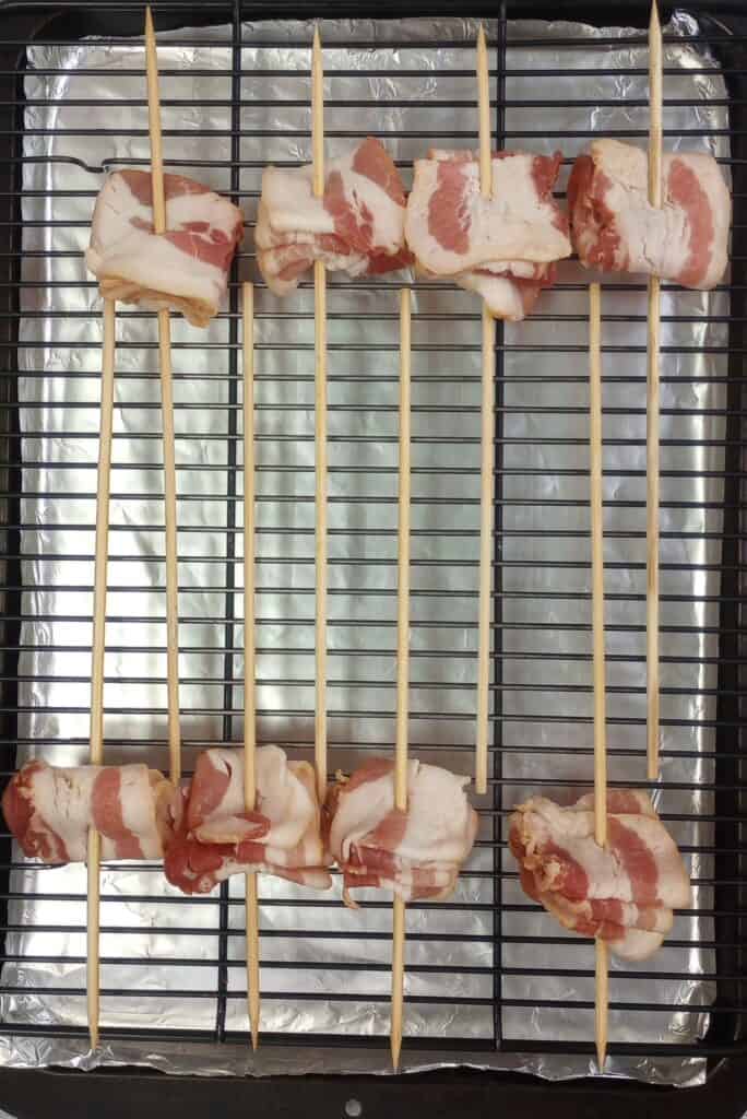 Bacon arranged accordion style on 12 inch bamboo skewers.