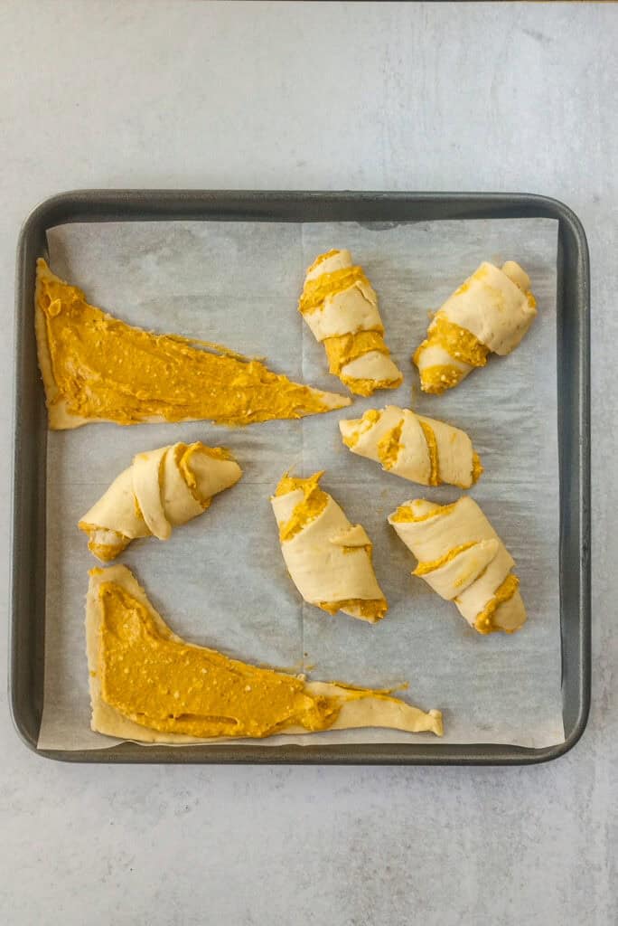 Pumpkin Cheesecake Filling evenly spread in each crescent roll. 