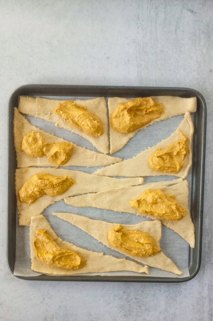 Pumpkin cheesecake filling inside each crescent triangle by the tablespoon. 