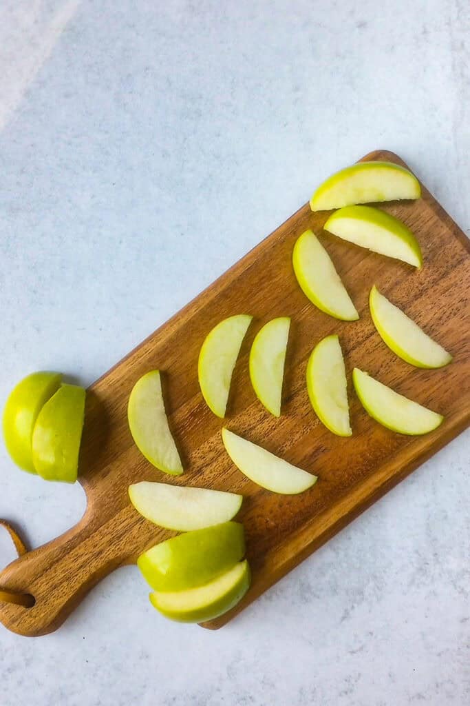 Overhead picture of apple wedges sliced thin.