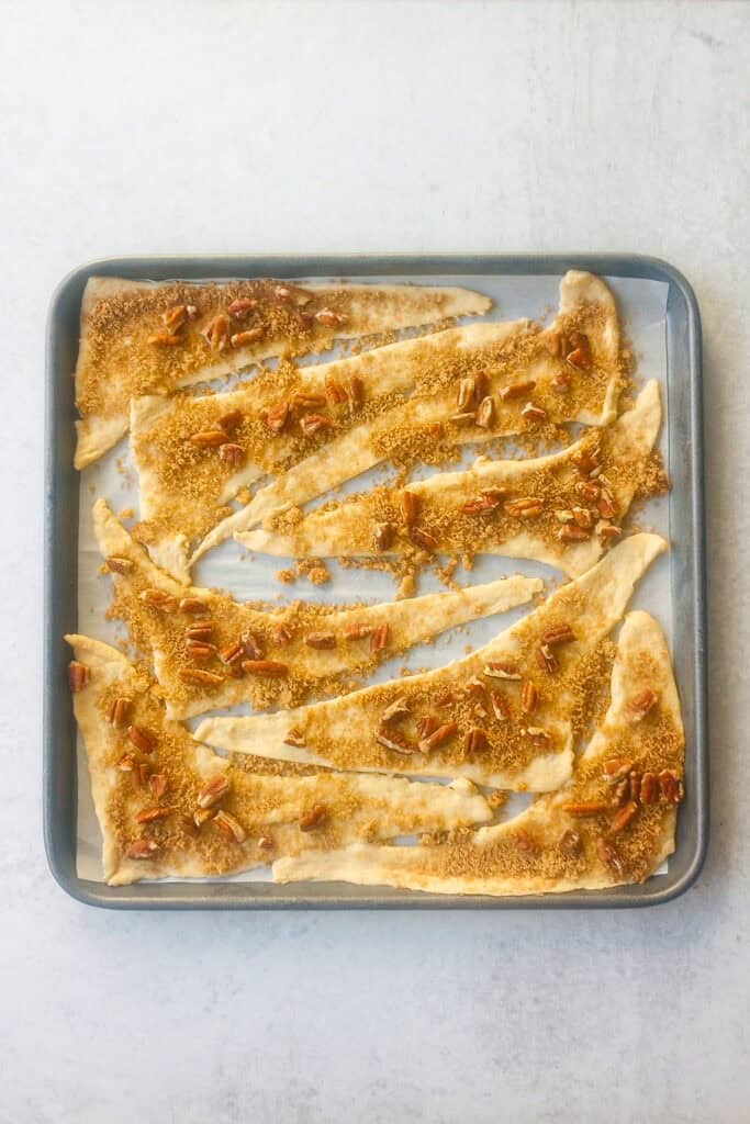 Overhead picture of crescent rolls stuffed with brown sugar, cinnamon and chopped pecans.