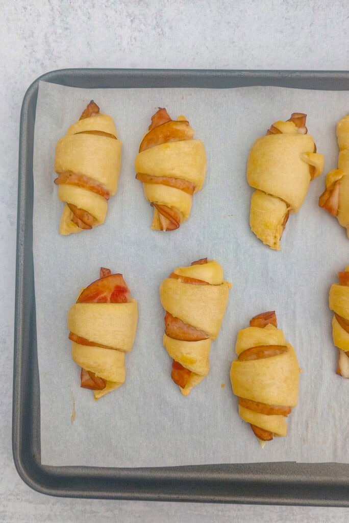 Overhead picture of ham and cheese crescent rolls baked for 7 minutes in the oven. 