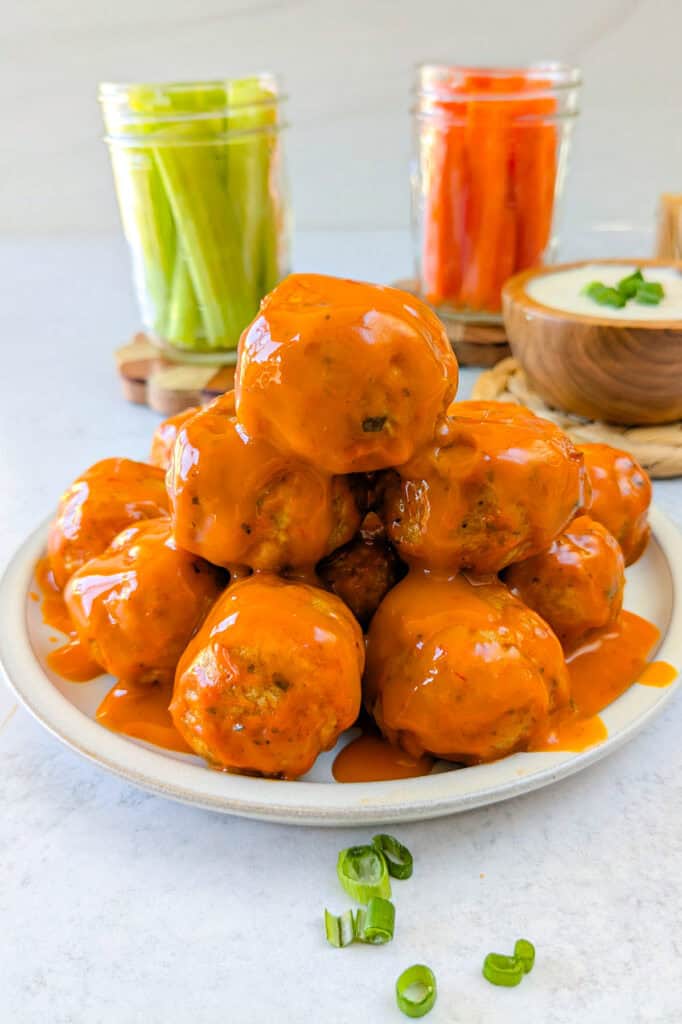 Picture of appetizer slathered in hot buffalo sauce. 