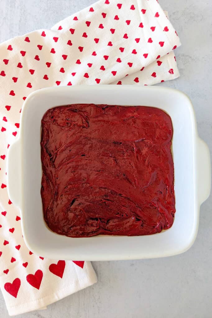 Overhead picture of brownie batter in a 8x8 inch baking dish. 