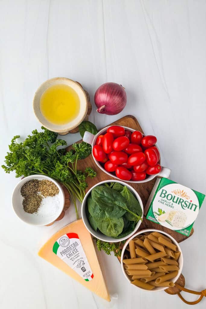 Overhead picture of all the ingredients needed to make baked Boursin cheese  pasta. 