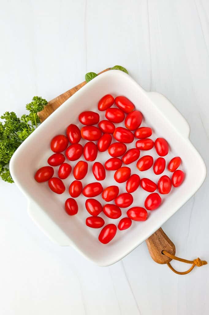 Overhead picture of grape tomatoes in a baking dish. 