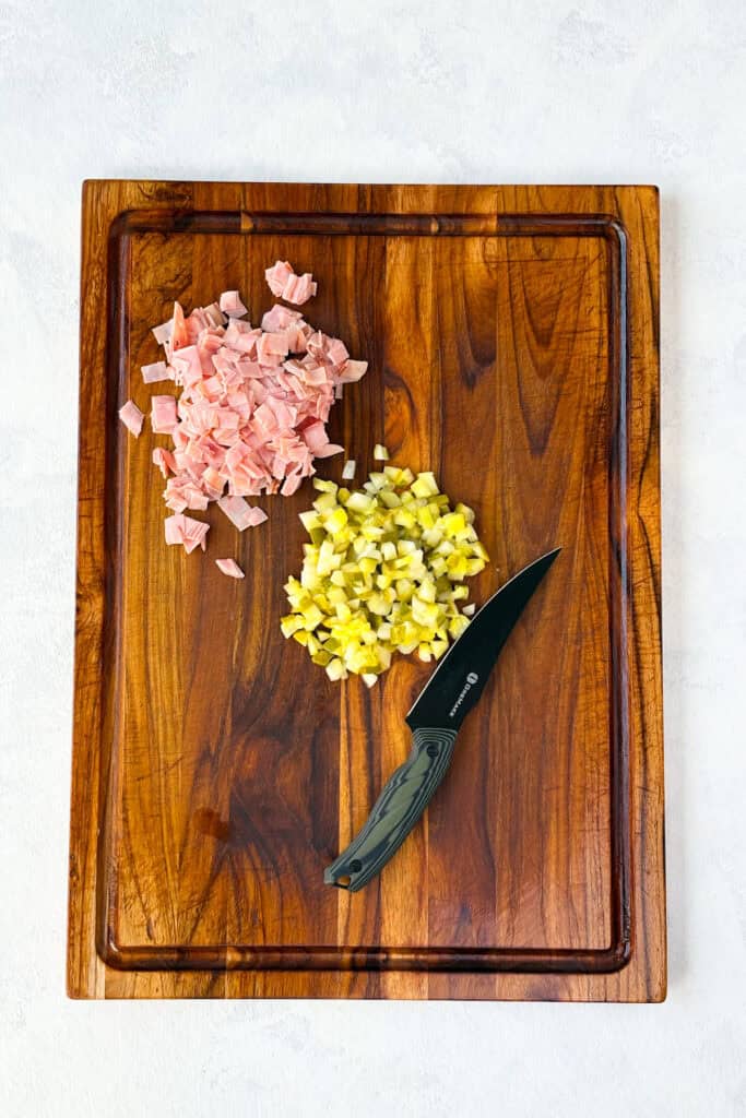 Overhead picture of diced ham and diced pickles.